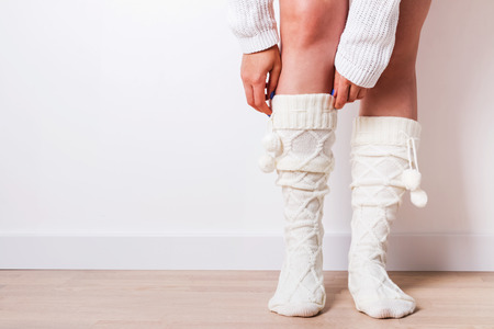 Woman wearing warm socks close-up.の写真素材