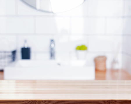Wooden surface on the blurred modern bathroom background.の写真素材