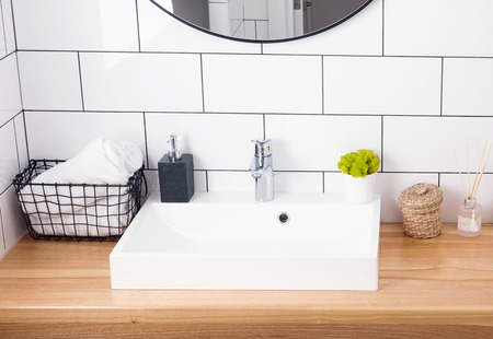 Modern bathroom interior in details. White tile and sink.の写真素材