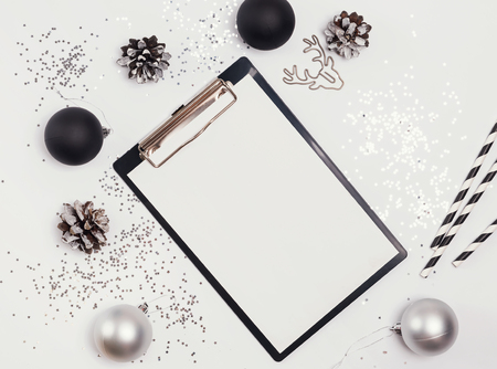 Clipboard mock-up on the table with Christmas decorの写真素材