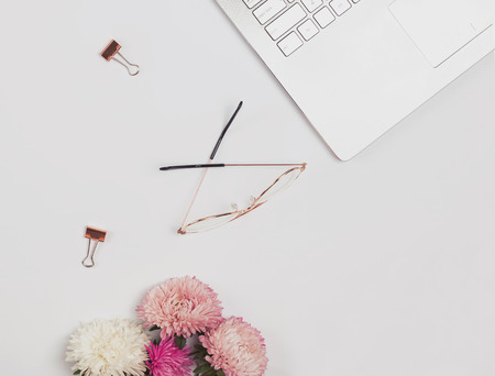 Minimalist feminine workplace concept, top view.の写真素材