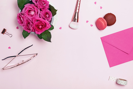 Creative frame with roses, feminine accessories and small paper heartsの写真素材