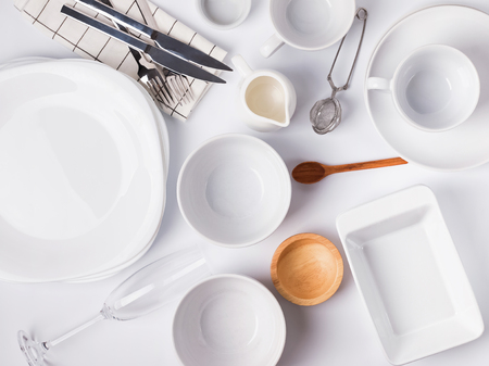 Different tableware and dishes on the white background, top view.の写真素材