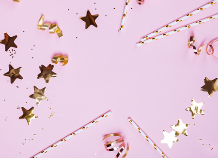 Birthday or Christmas party decor on pink baqckground.の写真素材