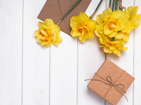 Spring composition with yellow flowers, giftbox and other objectsの写真素材