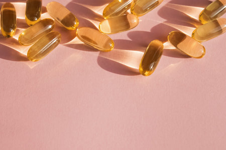 Pills or dietic supplements on the pink backgound