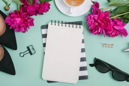 Creative summer flat lay with peonies and feminine accessories, top viewの写真素材