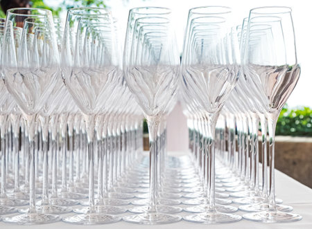 Big amount of empty champagne glasses on the table close-up