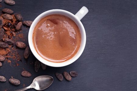 Hot chocolate or cocoa in a mug on the black backgroundの写真素材