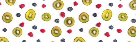 Creative fruit banner. Kiwis, blueberries and raspberries on the white background