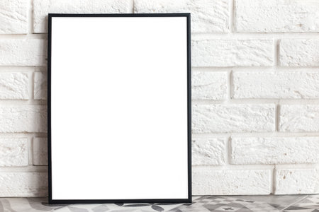 Empty frame mock-up in minimalist interior with whie brick wall.