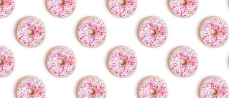 Creative background with delicious glazed donutsの写真素材
