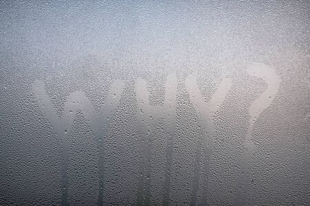 Word Why with question sign written on the sweaty glass.の写真素材