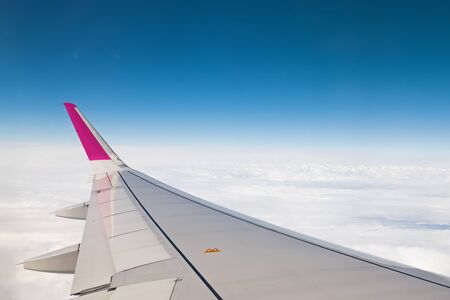 View from airplane window with blue skyの写真素材