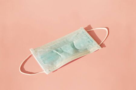 Medical mask of blue color for protection against flu and other diseases.の写真素材