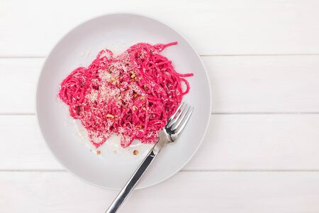 Spaghetti pasta with pink beetroot sause. Delicious lunchの写真素材
