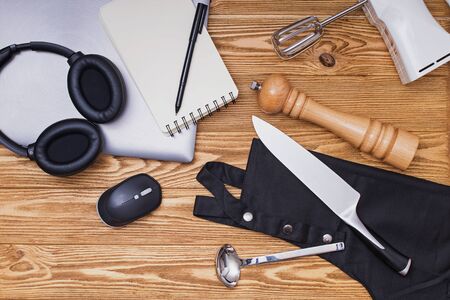 Various kitchenware utensils on the wooden background for cooking.の写真素材