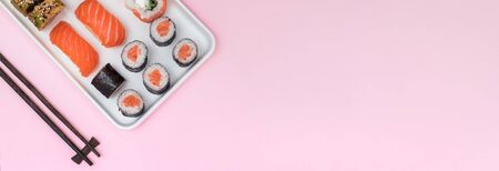 Sushi set with salmin on pink background, top view.の写真素材