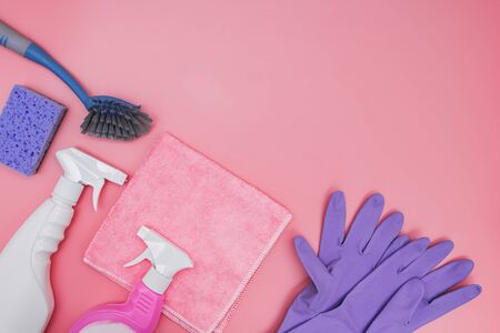 Flat lay composition with cleaning supplies on pink backgroundの写真素材