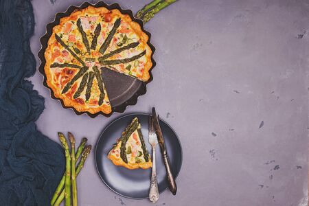 Homemade delicius quiche with asparagus and salmonの写真素材