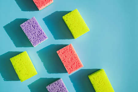 Cleaning sponges for washing dishes on blue backgroundの写真素材
