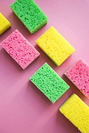Cleaning sponges for washing dishes on pink backgroundの写真素材