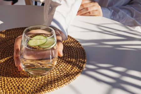 Fresh summer season detox drink with cucumber slices, lime and mint.の写真素材