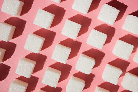 Cubes of sugar on a pink backgroundの写真素材