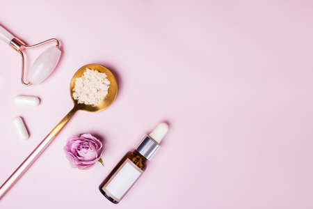 Skincare accessories on pink background.の写真素材