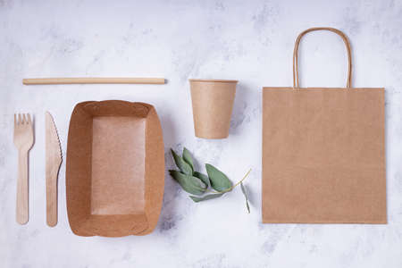 Eco friendly tableware and packaging flat layの写真素材