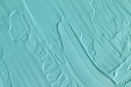 Blue cosmetic clay texture close up.