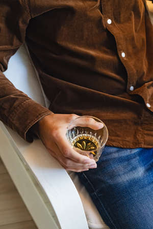 Close-up shot of the glass with whiskeyの写真素材