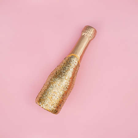 Bottle of champagne decorated with golden glitterの写真素材