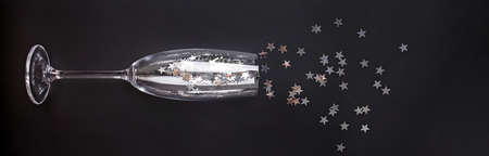Star shaped sparkles in sparkling wine glassの写真素材