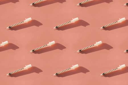 Syringes on a pink background seamless pattern.の写真素材