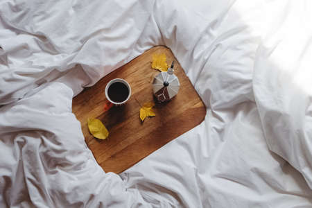 Still life composition with coffee and yellow leavesの写真素材