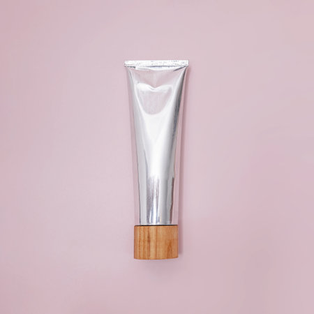 Metal tube of natural toothpaste on pinkの写真素材