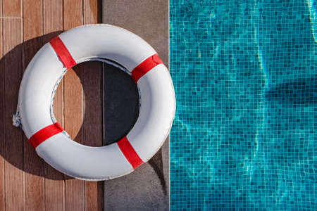 Top view of lifebuoy lying near the swimming poolの写真素材