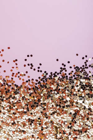Golden glitter on the pink with copy space. Festive backgroundの写真素材