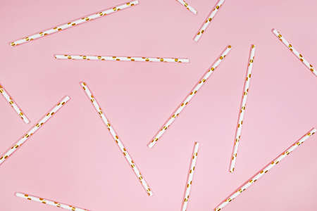 Paper straws on pink, festive birthday backgroundの写真素材