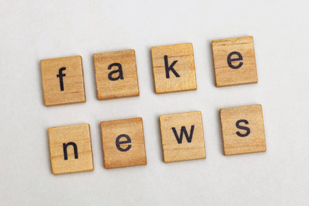 Wooden letters with text Fake news. Journalism, propaganda, social media