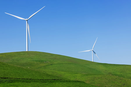Wind turbines on the green meadow, renewable energy, sustainable lifestyle