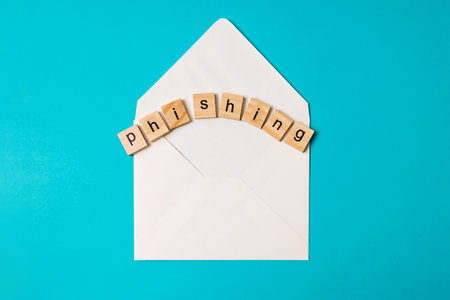 Email phishing, blank envelope and letters on blue backgroundの写真素材