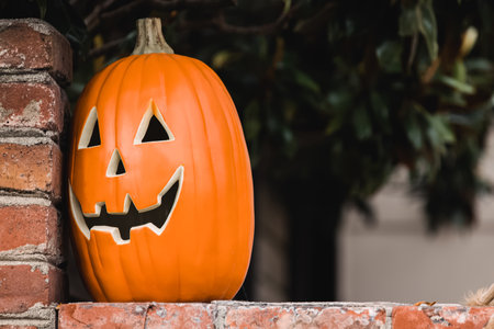 Ceramic decorative Halloween pumpkin outside of the house close-upの写真素材