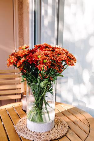 Bouquet of fall flowers in the vase in natural light. Autumn seasonの写真素材
