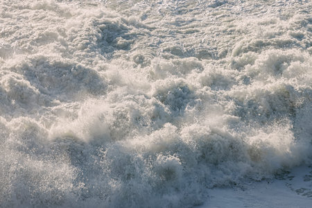 Close-up of powerful Pacific ocean waves making a foam on the surface