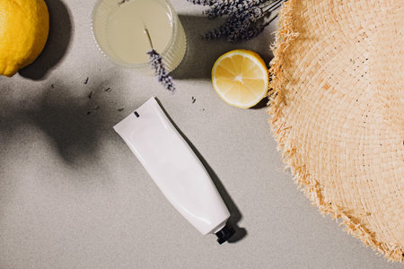 Lemonade, summer accessories and cream tube mock-up, harsh shadows