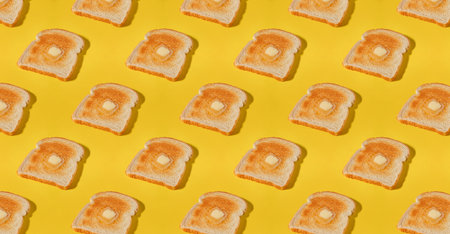 Slices of toasted bread with butter on the top, breakfast food backgroundの写真素材