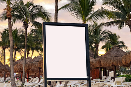 Blank sign mock-up in tropical resort with palm trees and sunset viewed in the backgroundの写真素材