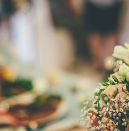 part of wedding bouquet with blurred background in restaurantの写真素材